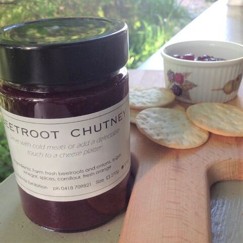 bottle of homemade beetroot chutney with crackers