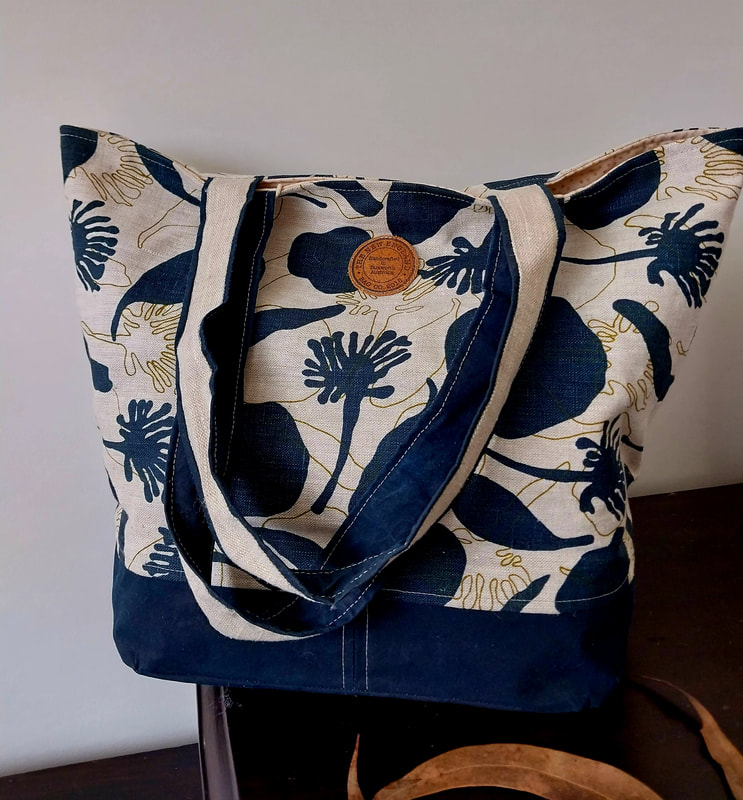 handmade fabric tote bag with navy blue flower pattern fabric