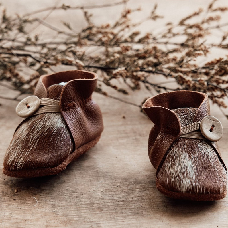 baby booties made from cow hide and leather