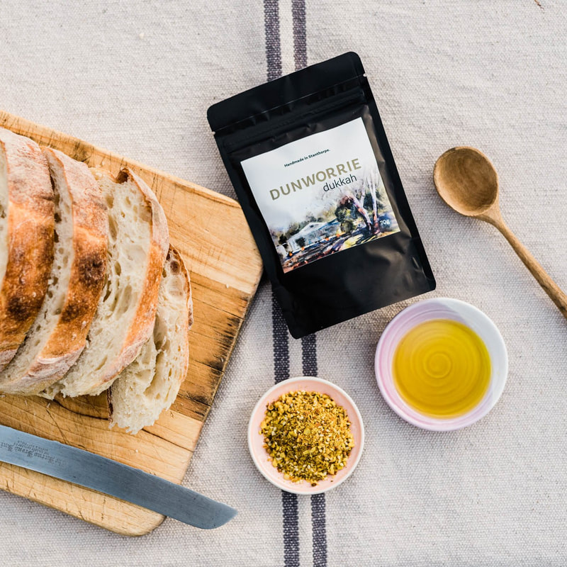 dish of dukkah and olive oil with sourdough bread