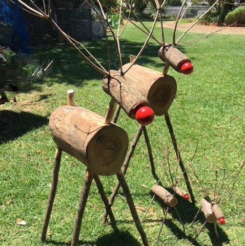 large garden art handmade reindeers made from collected wood